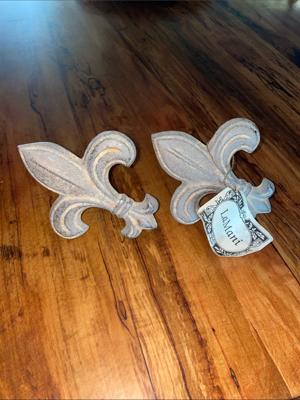 Heavy pair of Fleur-de-Lis Decorative Drapery Hooks in aged metal finish